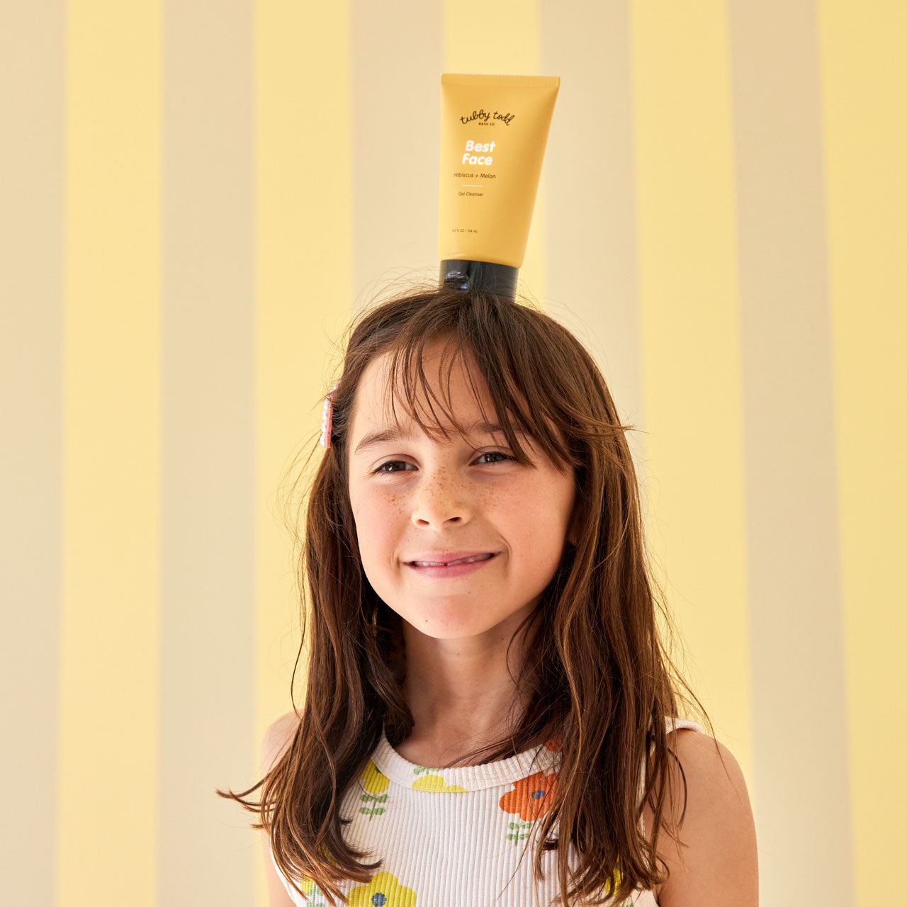 Best Face bottle on top of girls head